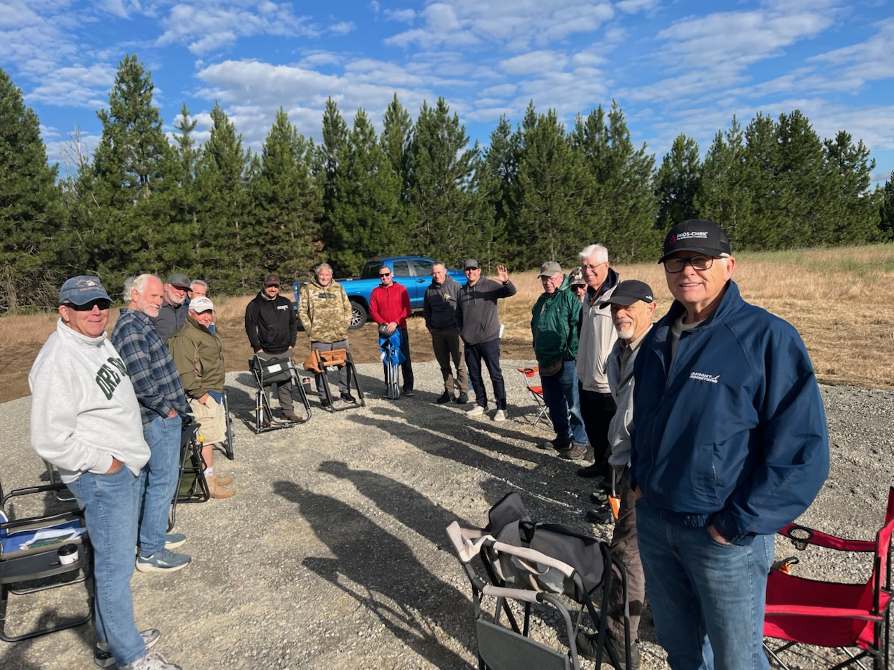 Men gathering for prayer on the land